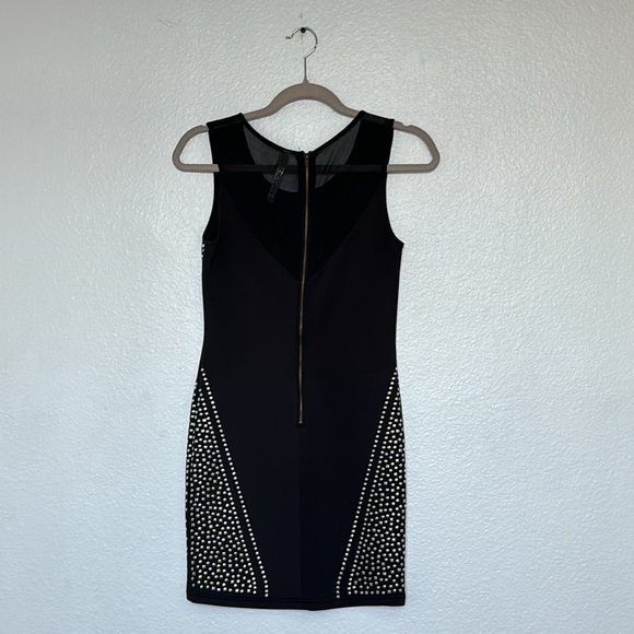 Short stretch dress with metallic stones on a black base, curvy cut, size S - Picture 7 of 10